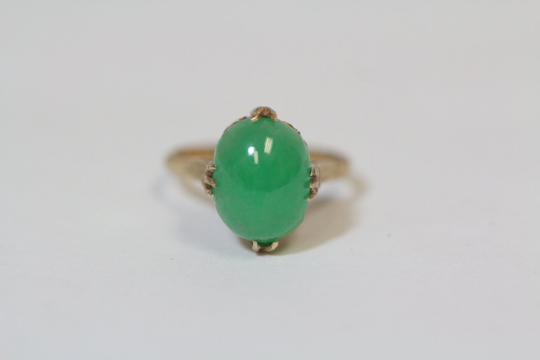 18K Y/G jadeite ring: 18K Y/G ring, center an apple green jadeite measures 11.5x10x4.2mm, wt. 3.5gm, size 6