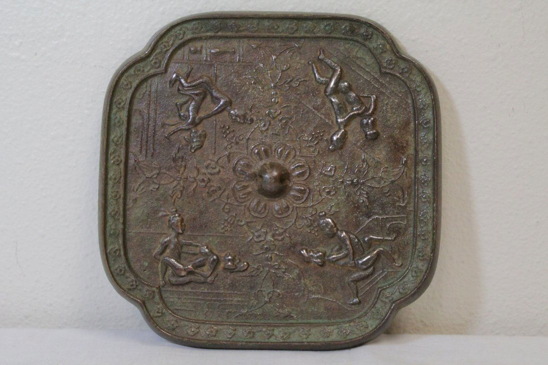Chinese bronze mirror: Chinese bronze mirror depicting erotic scene, 7"x7"