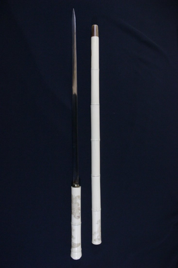 Japanese antique sword in bone carved cane: Japanese antique sword (24.5"L(blade:17"L)) conceal in bone carved cane (29.05"L), cane surface carved with monkey in relief, the Japan sword is in excellent condition and it is samurai sword quality