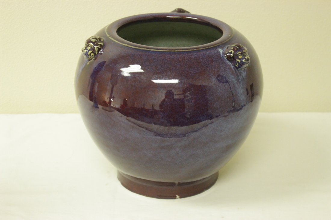 Chinese deep purple glazed jar: Chinese deep purple glazed jar with animal motif handles (bottom chip, 12.7"Hx15"dia)