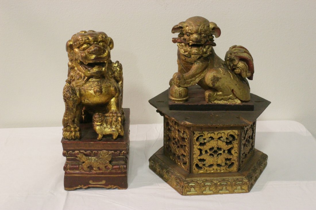 2 Chinese antique gilt wood fulion on gilt pedestal: 2 Chinese antique gilt wood carved fulion on gilt wood pedestal, one has repair, 18.3"Hx8"x11.5", 20"Hx15"dia