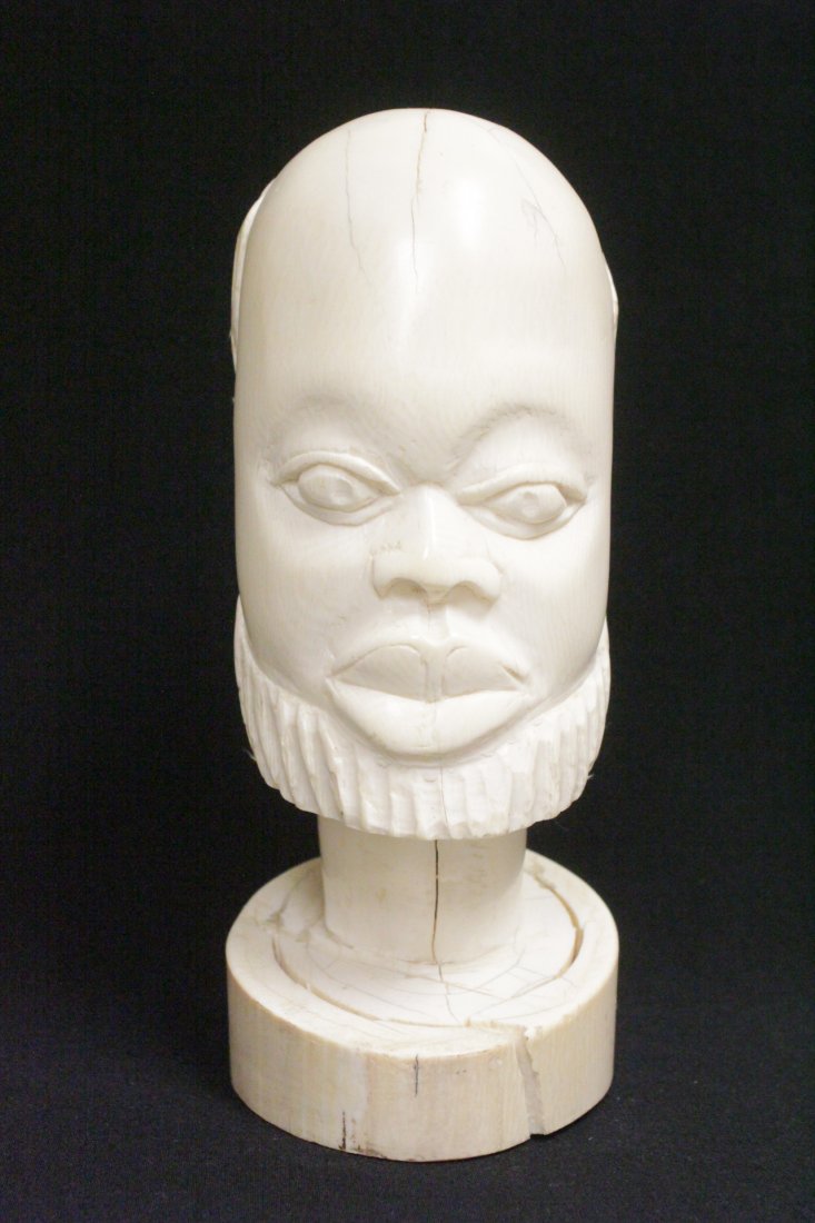 A large African antique ivory carved head: A large African antique ivory carved head (base crack), 9.5"H , NO INTERNATIONAL SHIPPING OF IVORY