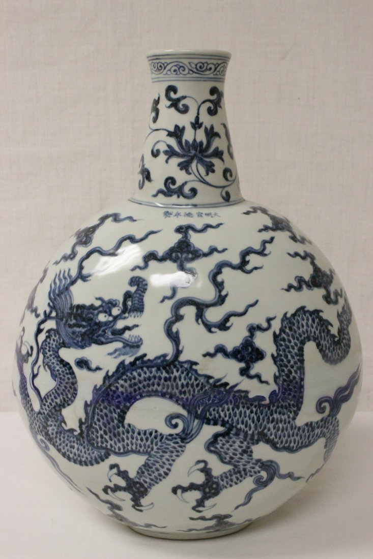 Large blue and white flask painted with dragon: Large blue and white flask painted with dragon, 18.75"Hx12.75"x8.3"