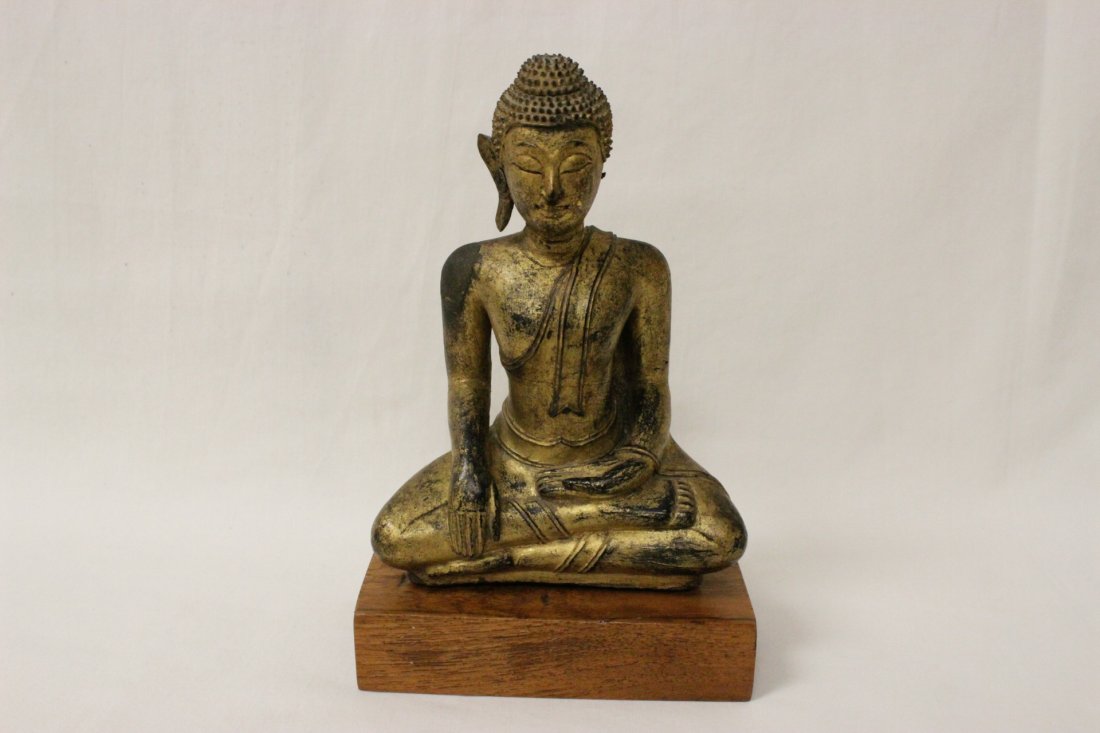 A gilt wood antique Thai Buddha: A fine gilt wood antique Thai Buddha, Ayutthaya period (one ear of Buddha missing), 5.8"H