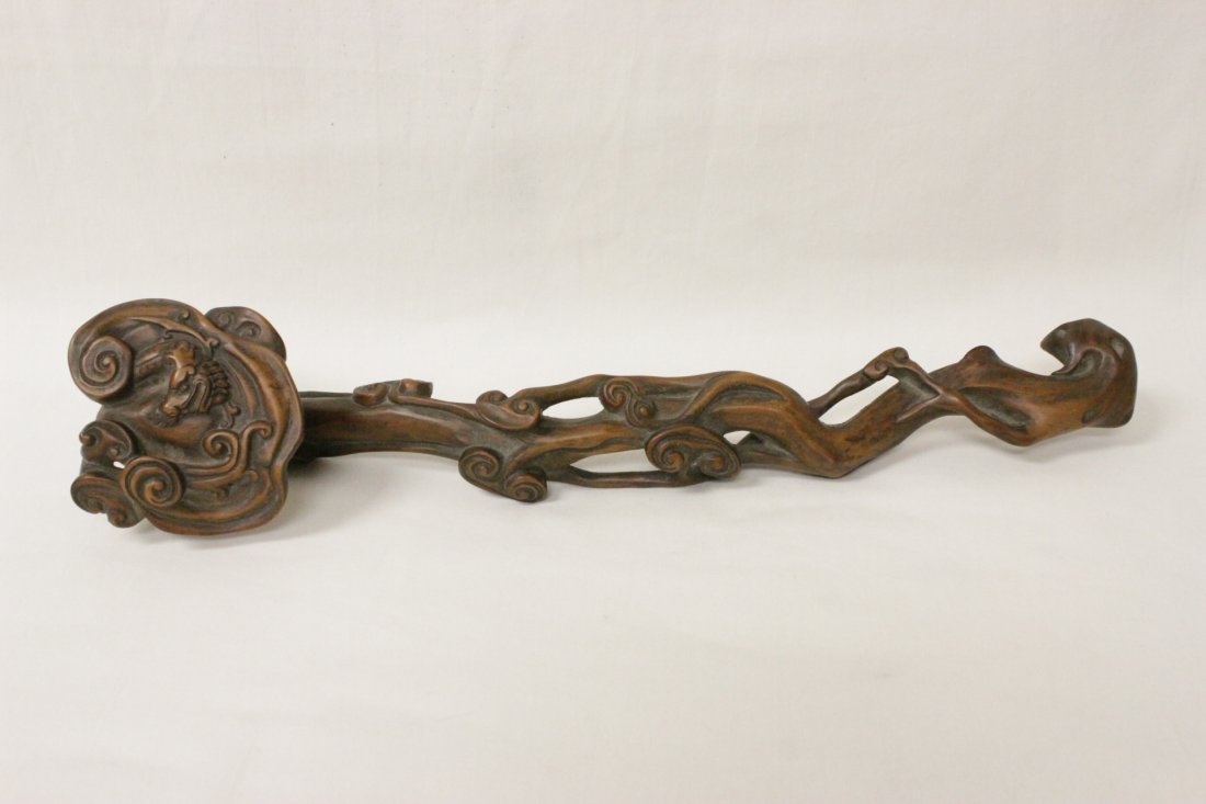 Chinese antique huangyang wood ruyi: An important Chinese antique huangyang wood carved ruyi, carved with lingzhi and dragon motif, 14.1"L