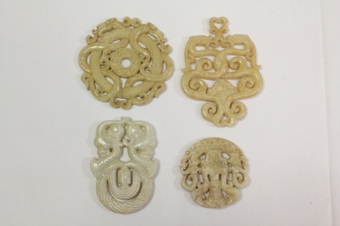 4 Chinese jade carved circular ornament: 4 Chinese jade carved circular ornament (one minor chip), 0.25"Dx2.95"dia, 3.45"x2.5"x0.25", 0.3"Dx2"dia, 2.85"x1.95"x0.3"
