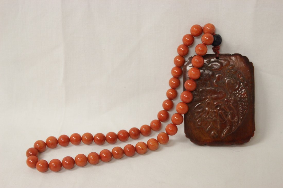 Horn plaque with coral like bead necklace (1 of 10)