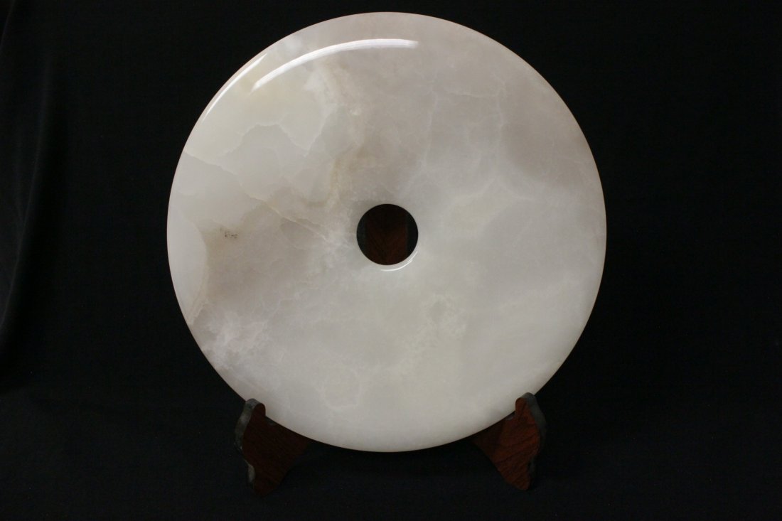 A large white agate carved disc (1 of 10)