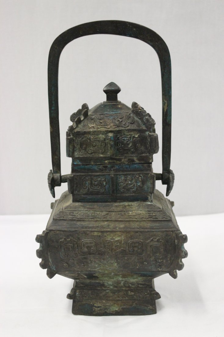 Chinese antique bronze covered hu with handle (1 of 9)