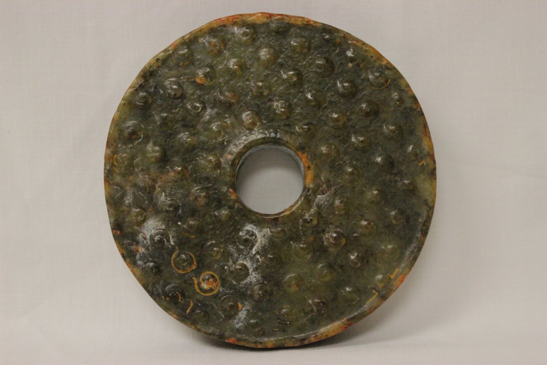 A large jade carved disc (1 of 8)