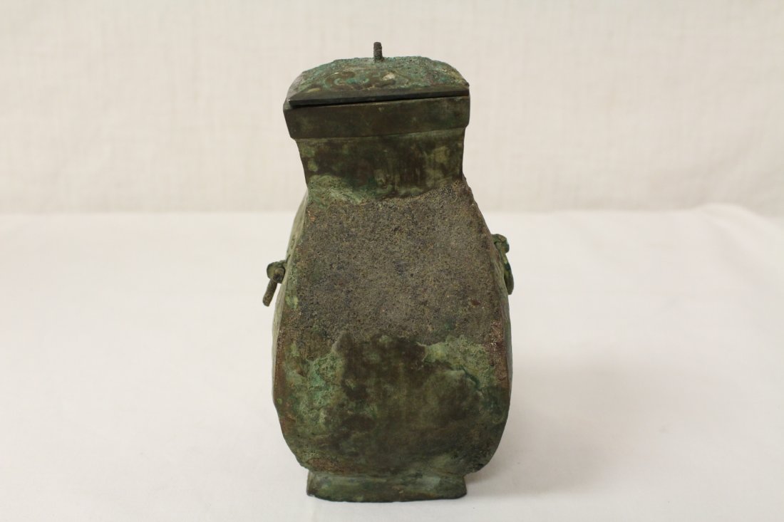 Archaic bronze wine vessel: Archaic bronze wine vessel (one handle damage), possible West Han dynasty, 6.1"Hx3.25"x3.25"