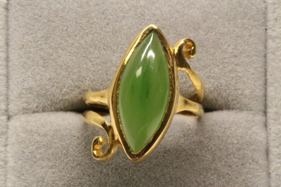 14K Y/G twist design jadeite ring: 14K Y/G twist design ring, center a translucent jadeite cabochon measures 19x8x4.5mm, size 7.5