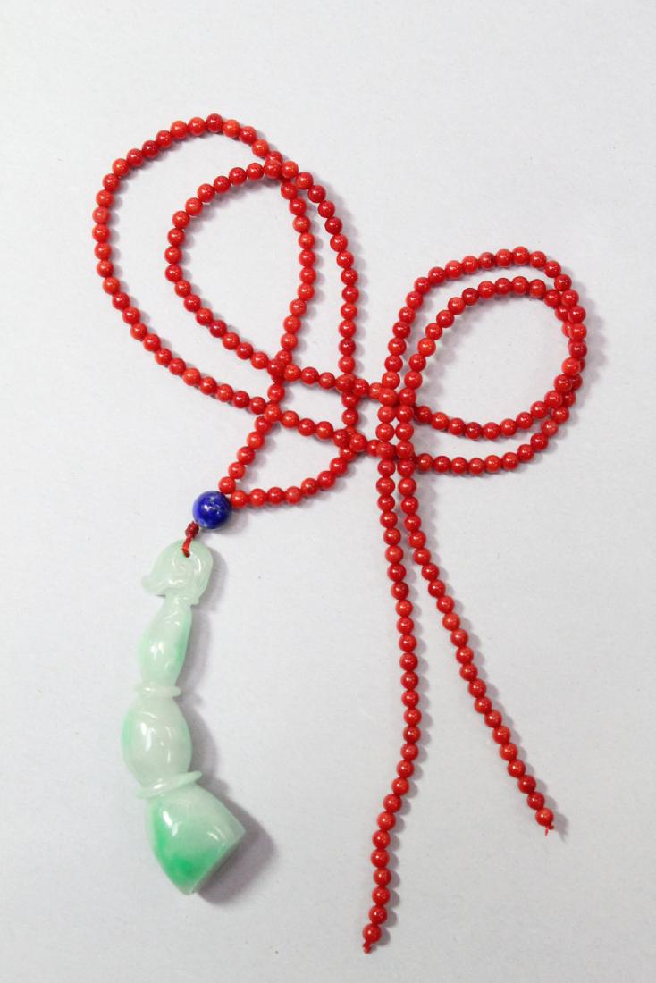 Chinese jadeite carving w/ a coral like bead necklace (1 of 10)