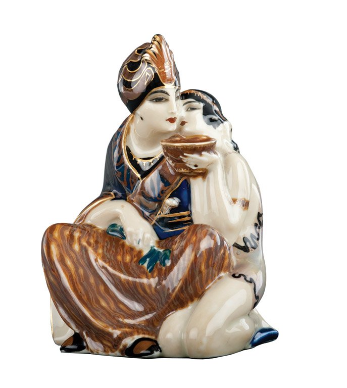 A fine Limoges porcelain figural nightlight of an Ar: A fine Limoges porcelain figural nightlight of an Arabian Prince with his consort signed Tamano 23cm high