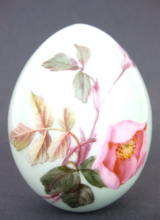 A Russian porcelain rose painted easter egg, circa: A Russian porcelain rose painted easter egg, circa 1900 11cm high