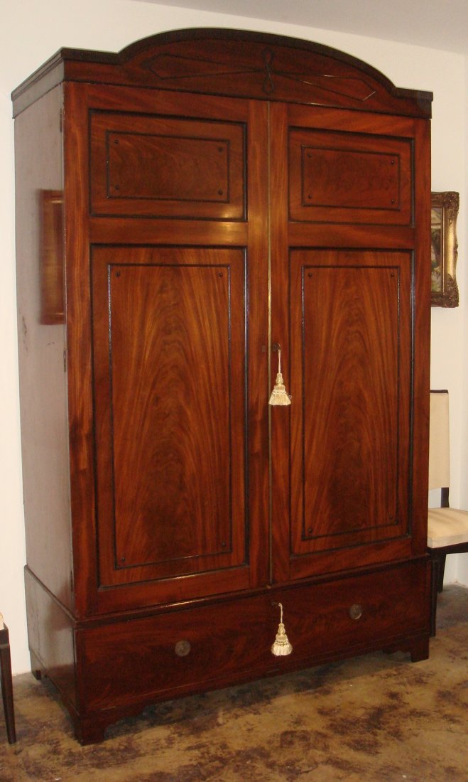 A fine Regency mahogany wardrobe with ebony stringi: A fine Regency mahogany wardrobe with ebony stringing, English, circa 1810 235 x 146 x 66cm