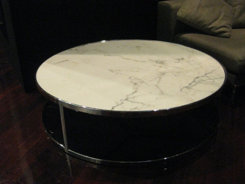 A Minotti Huber white marble top coffee table 120c: A Minotti Huber white marble top coffee table 120cm diameter, 32cm high Retail price $7,362