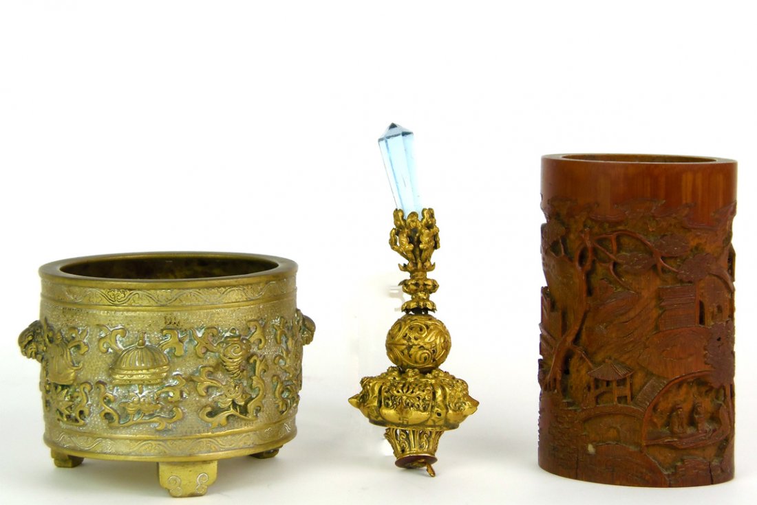 Three objects; A gold and blue glass hat finial; a: Three objects; A gold and blue glass hat finial; a bronze incense burner decorated with the eight Buddhist emblems, two character mark to base: together with a carved bamboo brush pot finial 12.5cm lo