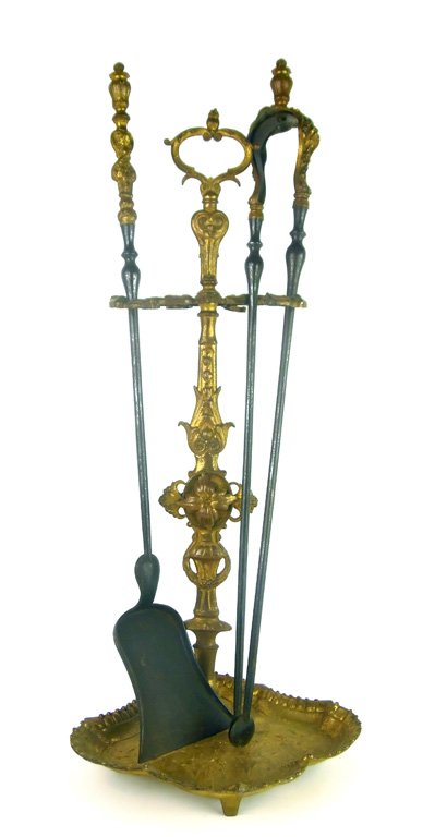 A set of gilt-bronze fire tools and stand, French, circ: A set of gilt-bronze fire tools and stand, French, circa 1860