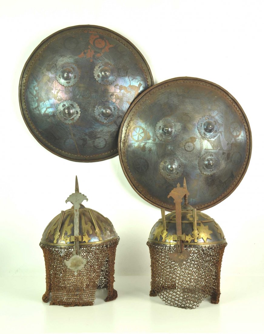 Two Indo-Persian helmets and shields in the Antique sty: Two Indo-Persian helmets and shields in the Antique style helmets 21cm high, shields 43cm high