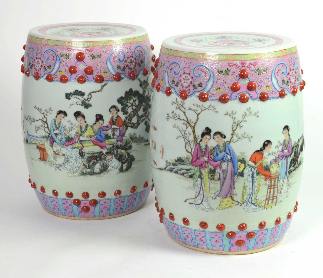 A pair of Chinese famille rose drum stools, 20th centur: A pair of Chinese famille rose drum stools, 20th century each one decorated with ladies in a garden 47cm high, 29cm diameter Provenance David Wright Antiques, Hobart circa 1993
