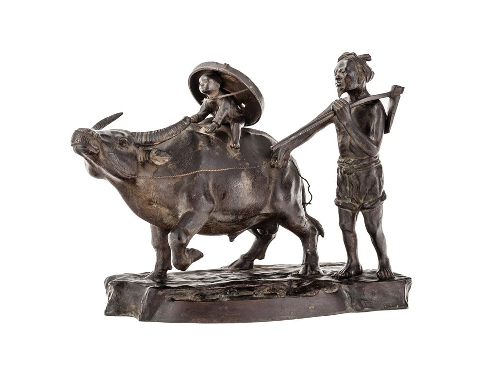 A fine quality large bronze sculpture of a man and a bo: A fine quality large bronze sculpture of a man and a boy riding on a buffalo by Ishikawa, Vietnamese/Japanese signed and dated 1920 26cm high
