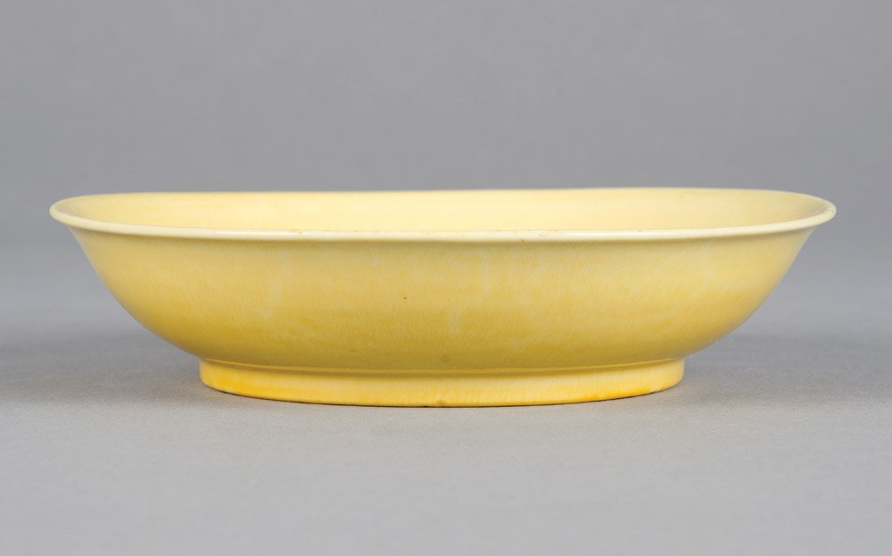 A Chinese Imperial yellow-glazed saucer dish, Jiajing m: A Chinese Imperial yellow-glazed saucer dish, Jiajing mark and period, 1522-1566 17.5cm diameter Provenance Sidney L. Moss, London attached label to verso Private Collection, Melbourne