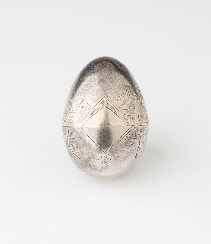 RUSSIAN SILVER EASTER EGG; engraved floral design, gilt: RUSSIAN SILVER EASTER EGG; engraved floral design, gilt interior and highlights. 5cm x 4cm. VG condition