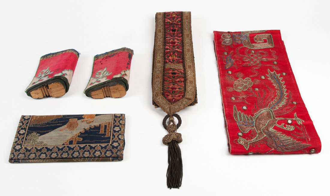A Chinese red silk and gold thread dragon robe and a: A Chinese red silk and gold thread dragon robe and a collection of various Chinese and Indonesian textiles