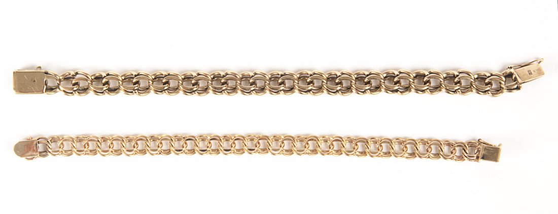 BRACELETS: Two 14ct double cable link bracelets (10: BRACELETS: Two 14ct double cable link bracelets (10 grams) and a 9ct gold bracelet (22 grams).