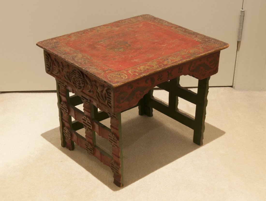 An unusual small red and gilt lacquered footstool,: An unusual small red and gilt lacquered footstool, Chinese, 19th century 30cm high, 39cm wide and 33cm deep $300–500