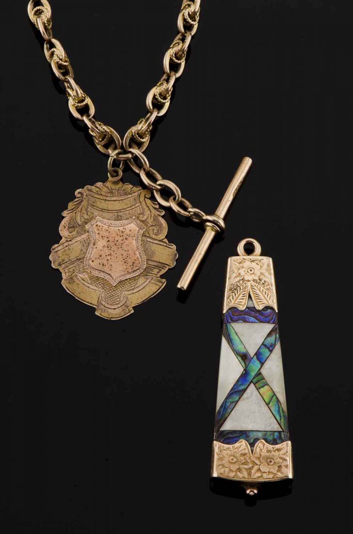 An antique 15ct gold Australian fancy link watch chain: An antique 15ct gold Australian fancy link watch chain with 9ct fob by Willis and an inlaid mother of pearl and paua shell fob. $700–900