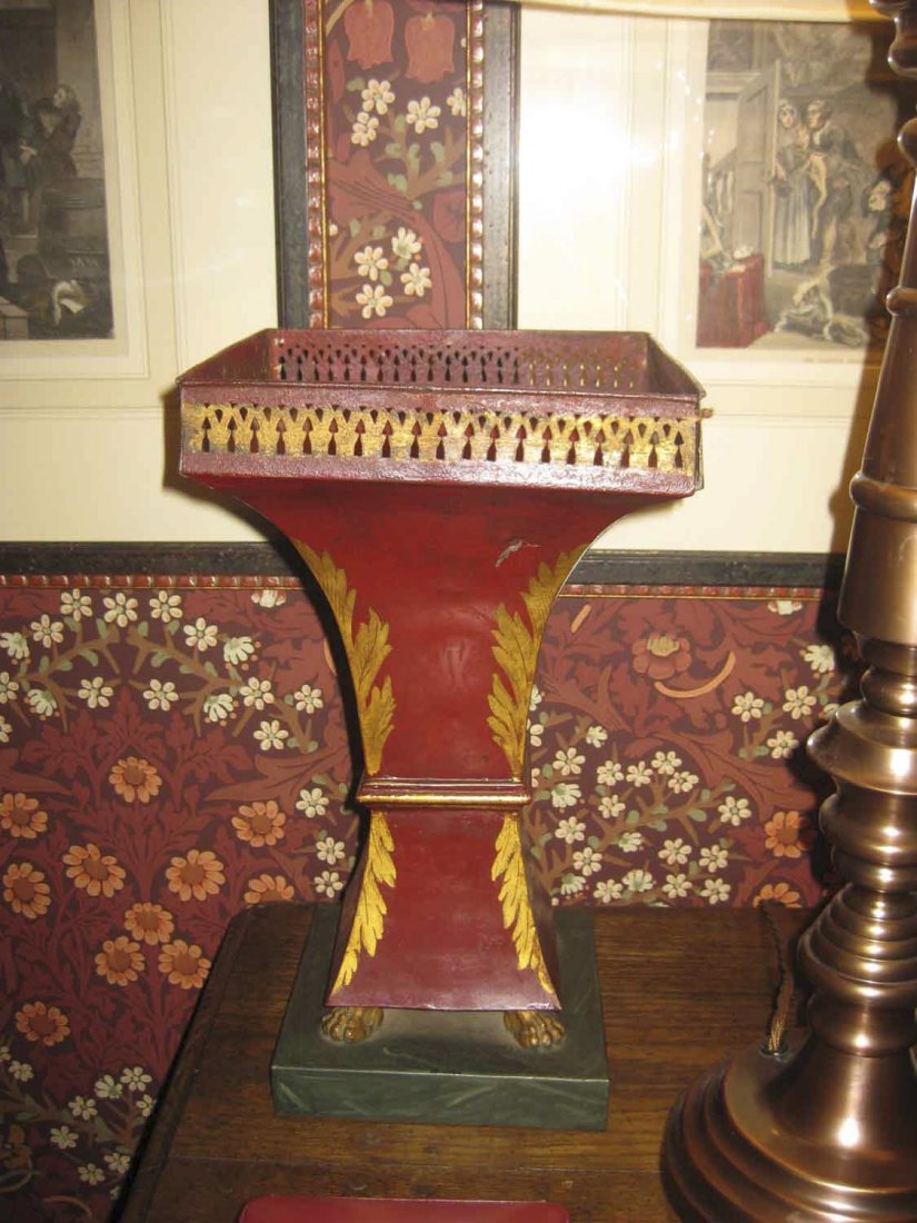 A pair of tole ware jardinières, decorated with: A pair of tole ware jardinières, decorated with acanthus leaves on a maroon ground 36cm high $200–300