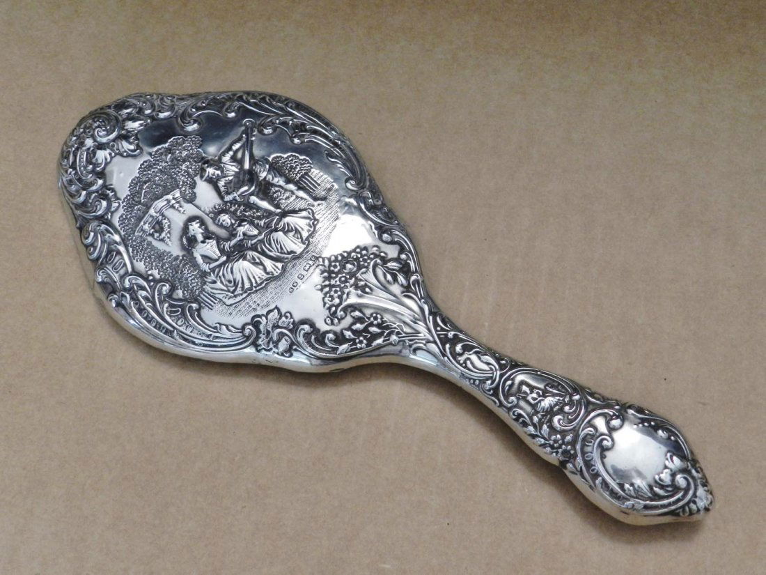 Two sets of English silver dressing table accessories,: Two sets of English silver dressing table accessories, Edwardian and later Comprising a pair of silver hair brushes, Walker & Hall, Sheffield, 1904; a silver hand mirror, Birmingham, 1904; a silver mo