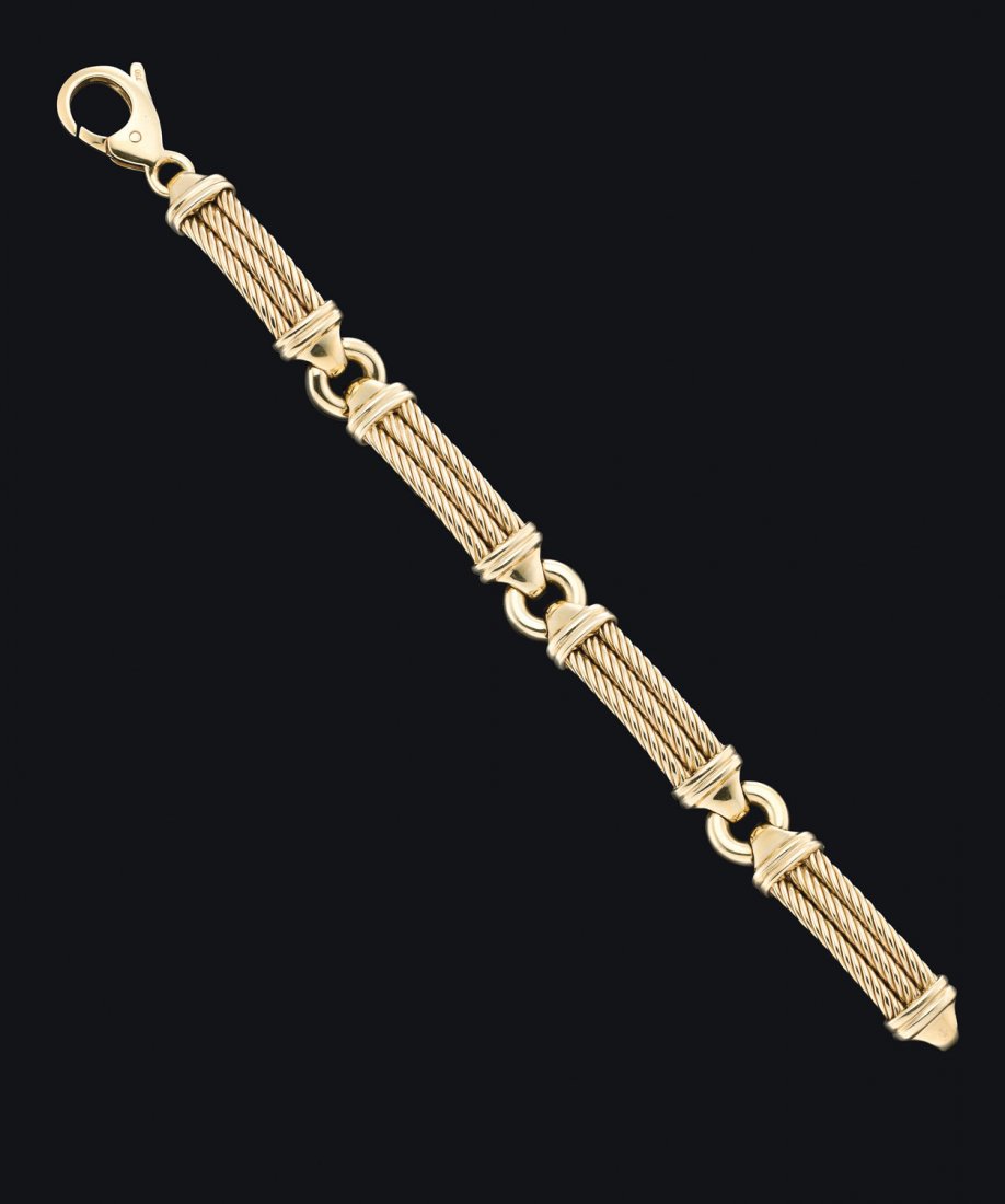 A gold Chevron bracelet by Phillippe Charriol. 18ct: A gold Chevron bracelet by Phillippe Charriol. 18ct yellow gold. Length 18cm. Weight 53.3 grams. Original box and papers. $2,000–3,000