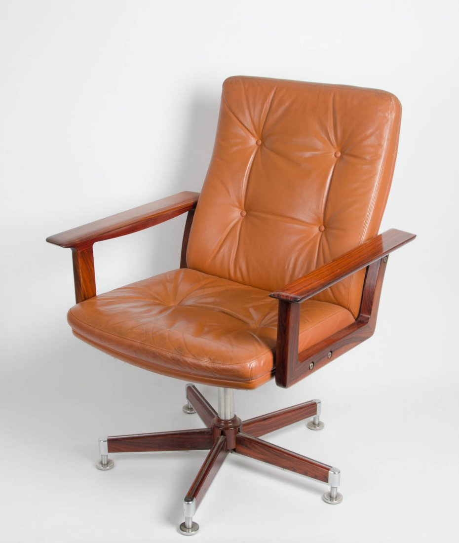 A Scandinavian leather upholstered rosewood desk chair,: A Scandinavian leather upholstered rosewood desk chair, designed by Arne Vodder, circa 1950