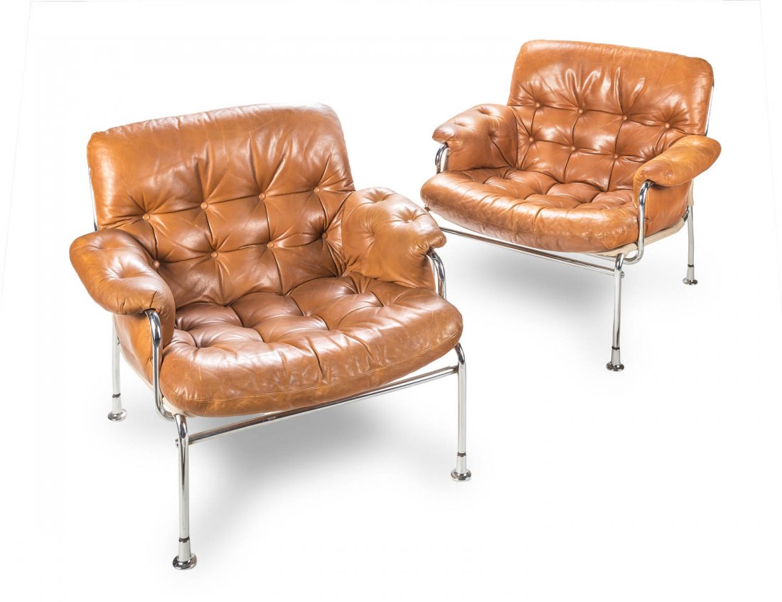 A pair of Scandinavian chrome and leather armchairs, in: A pair of Scandinavian chrome and leather armchairs, in the style of Bruno Mathsson, circa 1970