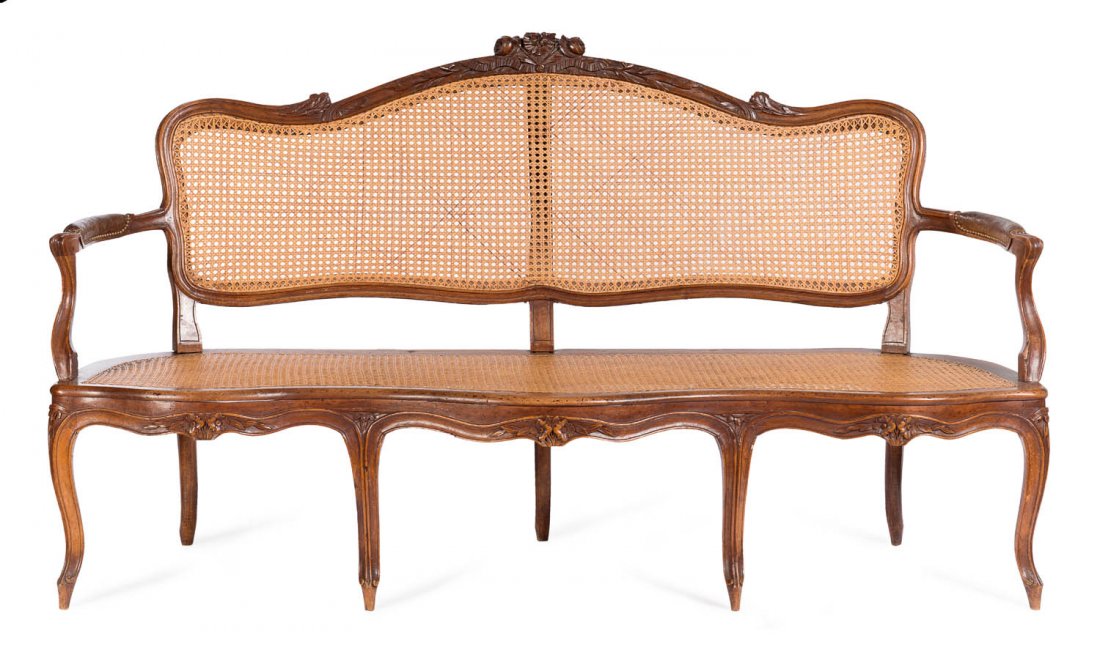 A Louis XV walnut and cane Canape, French, 18th: A Louis XV walnut and cane Canape, French, 18th century 186cm wide Stamped Maker Pillot Nimes Provenance: Purchased from Robert Haines Gallery, David Jones, Sydney, NSW