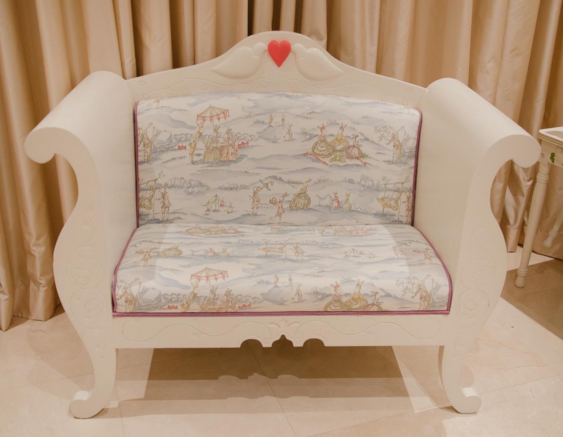 A painted and upholstered childrens couch: A painted and upholstered childrens couch length of back 106cm