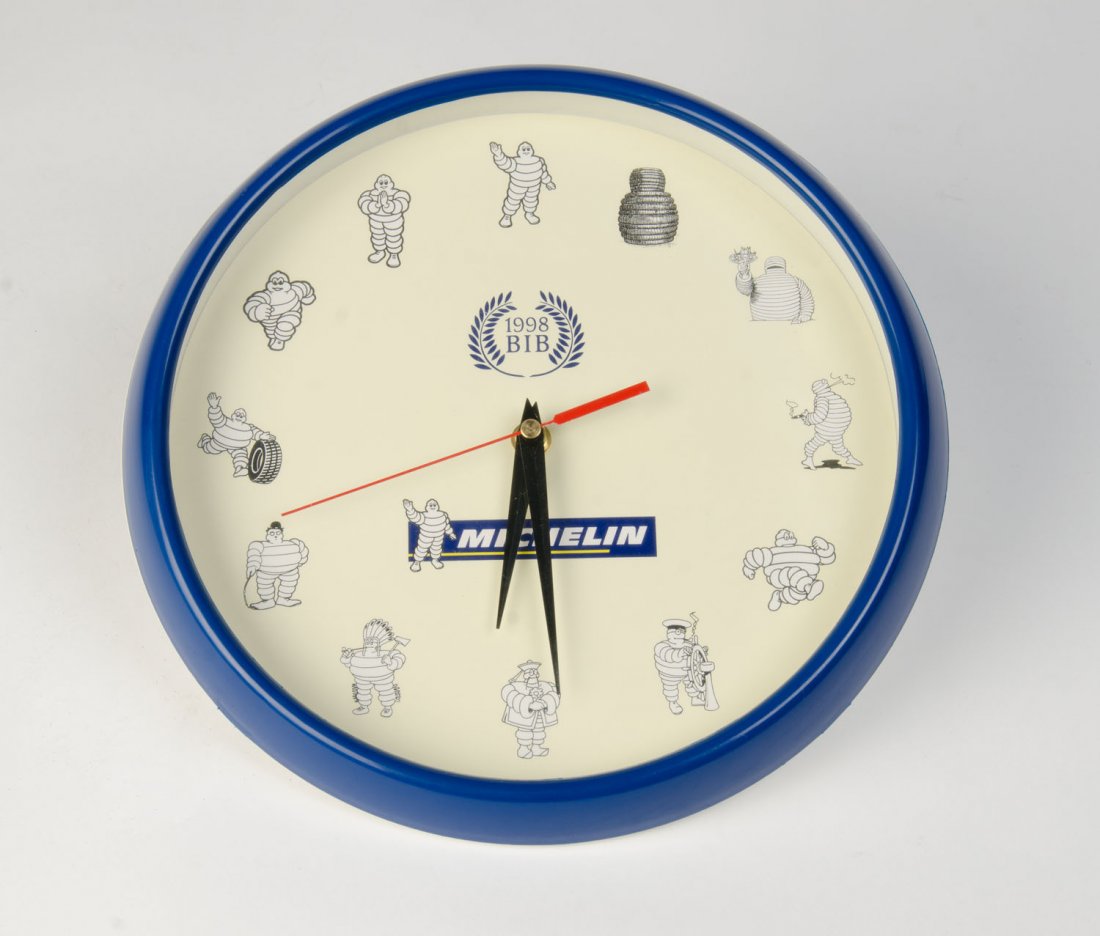 MICHELIN: A collection of Michelin wall clocks; the: MICHELIN: A collection of Michelin wall clocks; the largest being 43cms tall (4 items).