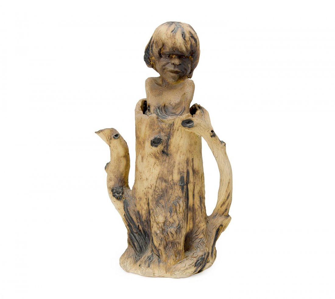 William Ricketts pottery tea pot with branch handle &: William Ricketts pottery tea pot with branch handle & spout, base decorated with picaninny face & lid mounted with Aboriginal bust finial. 35cm Provenance: Private collection Melbourne, previo