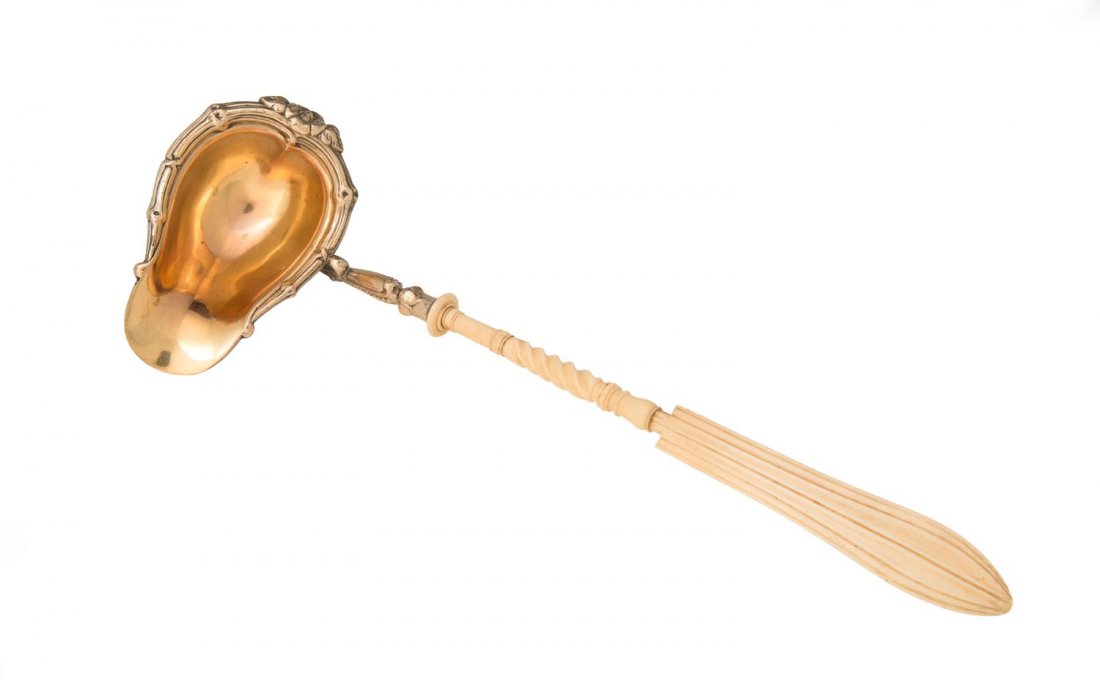 A WMF German silver plated ladle with bone handle and: A WMF German silver plated ladle with bone handle and gilt wash interior, late 19th Century. 35cm