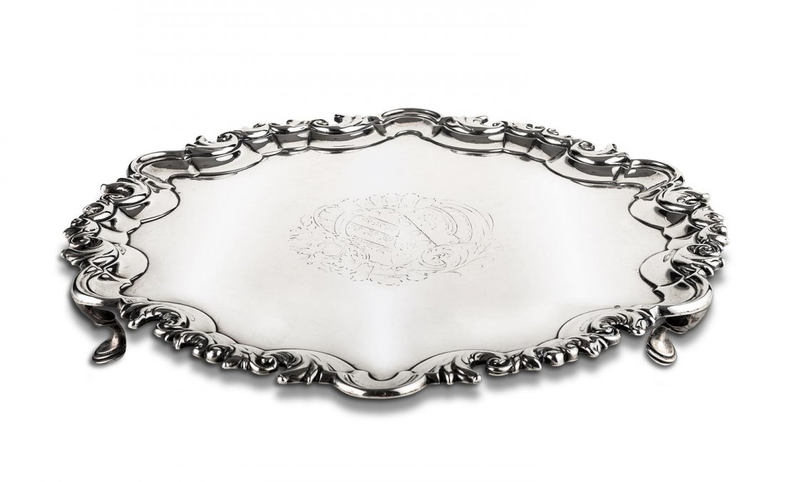 A Georgian Irish sterling silver circular salver by: A Georgian Irish sterling silver circular salver by John Walker Dublin, circa 1745 26cm diameter 705grams