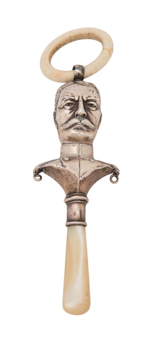 A George V sterling silver child's rattle, depicting (1 of 1)