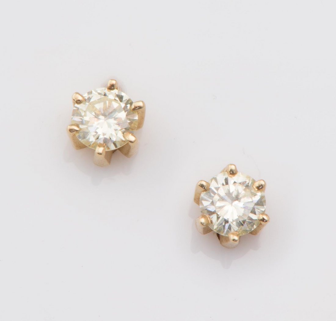 A pair of diamond studs, estimated total weight of (1 of 1)
