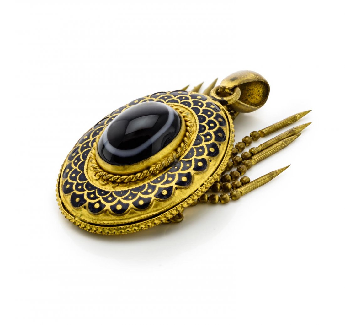 A Victorian pinchbeck and enamel tassle pendant, set: A Victorian pinchbeck and enamel tassle pendant, set with a paste cabochon resembling banded agate.