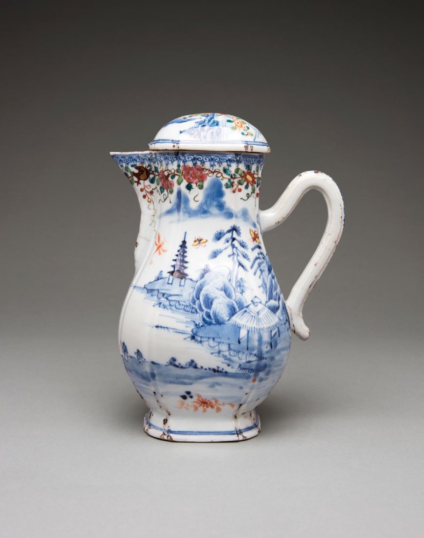 A Chinese porcelain milk jug and cover, Qing dynasty,: A Chinese porcelain milk jug and cover, Qing dynasty, 18th century decorated in under glaze blue and over glaze enamel with a garden scene, "The British Antique Dealers' Association" sti