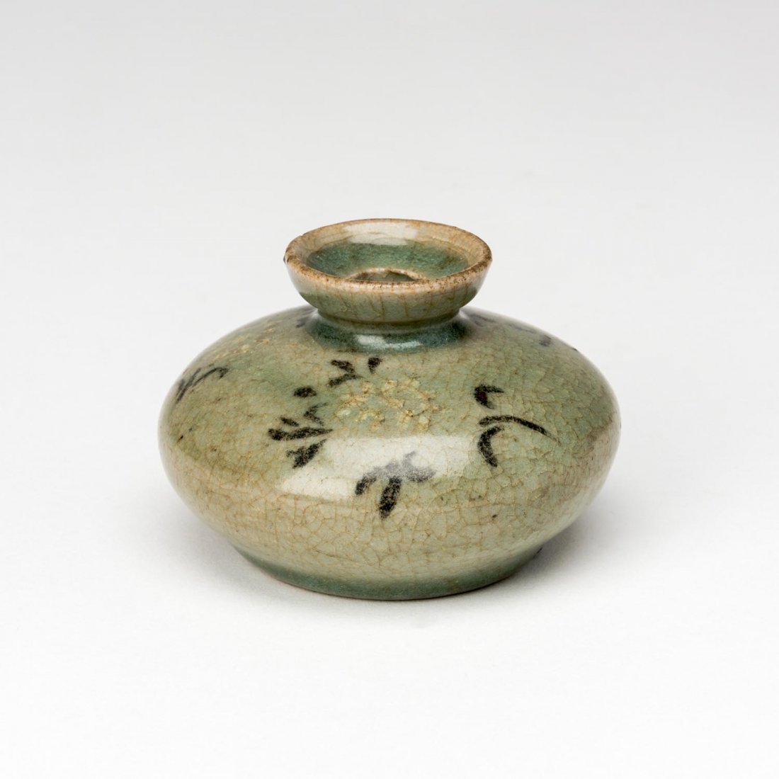 A Korean celadon oil jar, Koryo Dynasty (918-1392) (1 of 2)