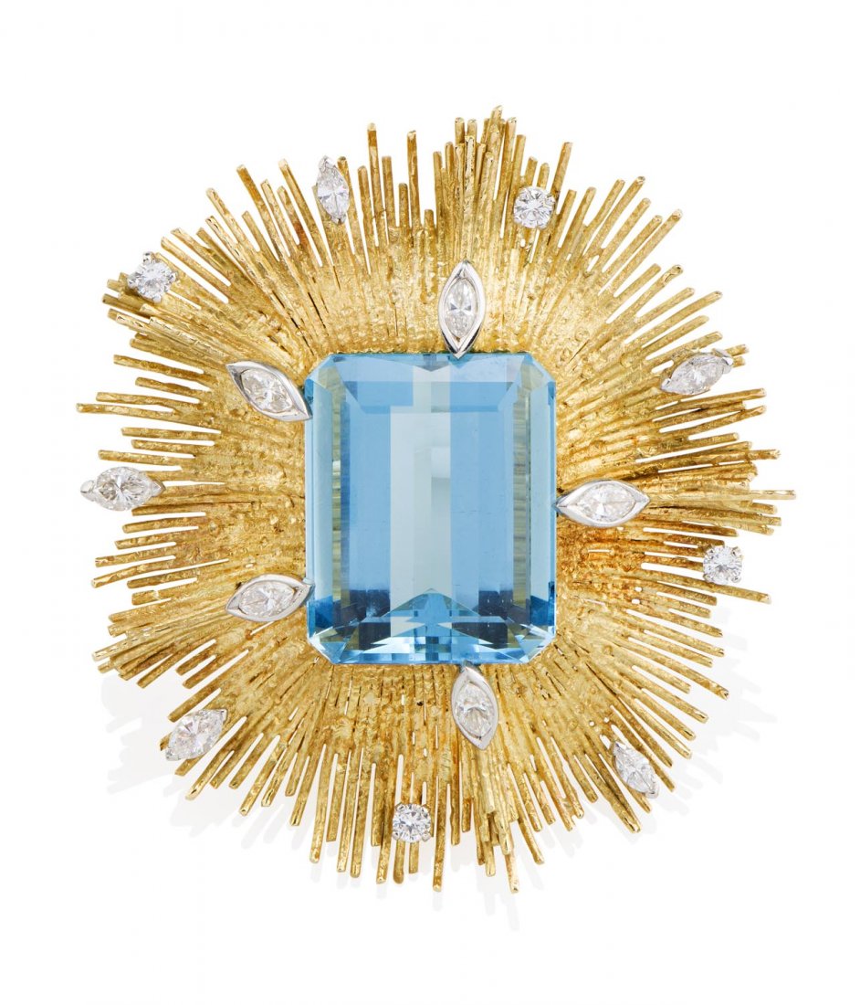 An aquamarine and diamond pendant, circa 1970's,: An aquamarine and diamond pendant, circa 1970's, attributed Andrew Grima, London. The emerald cut aquamarine of estimated weight 48 carats in a textured starburst frame set throughout with four ro