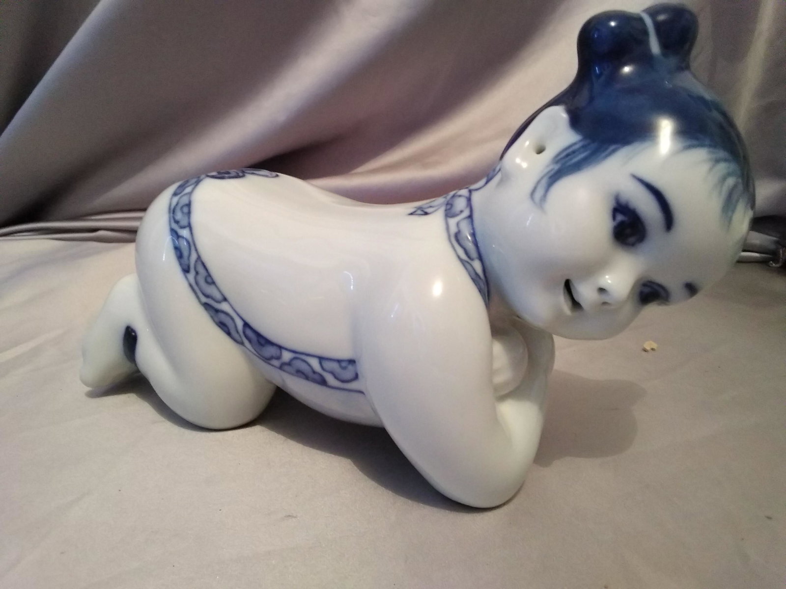 Chinese porcelain pillow in the form of a baby girl (1 of 6)